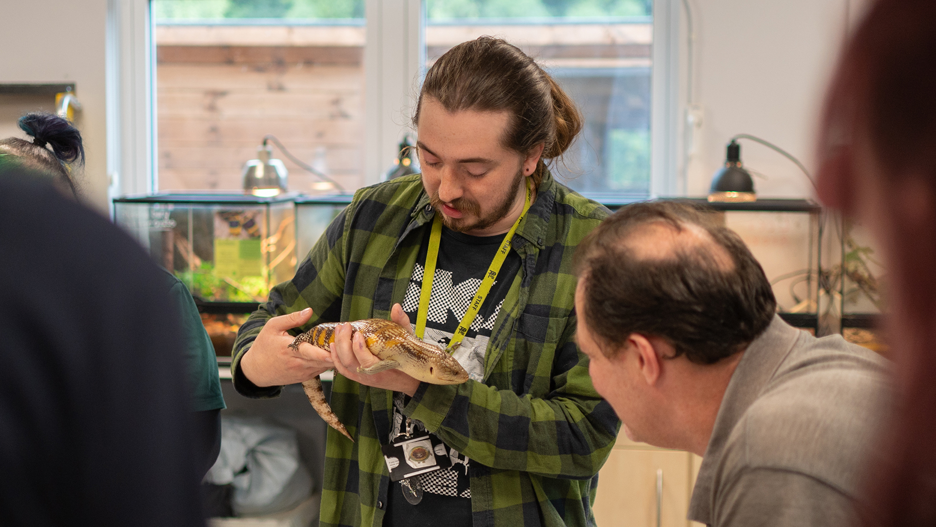 Man holding small reptile