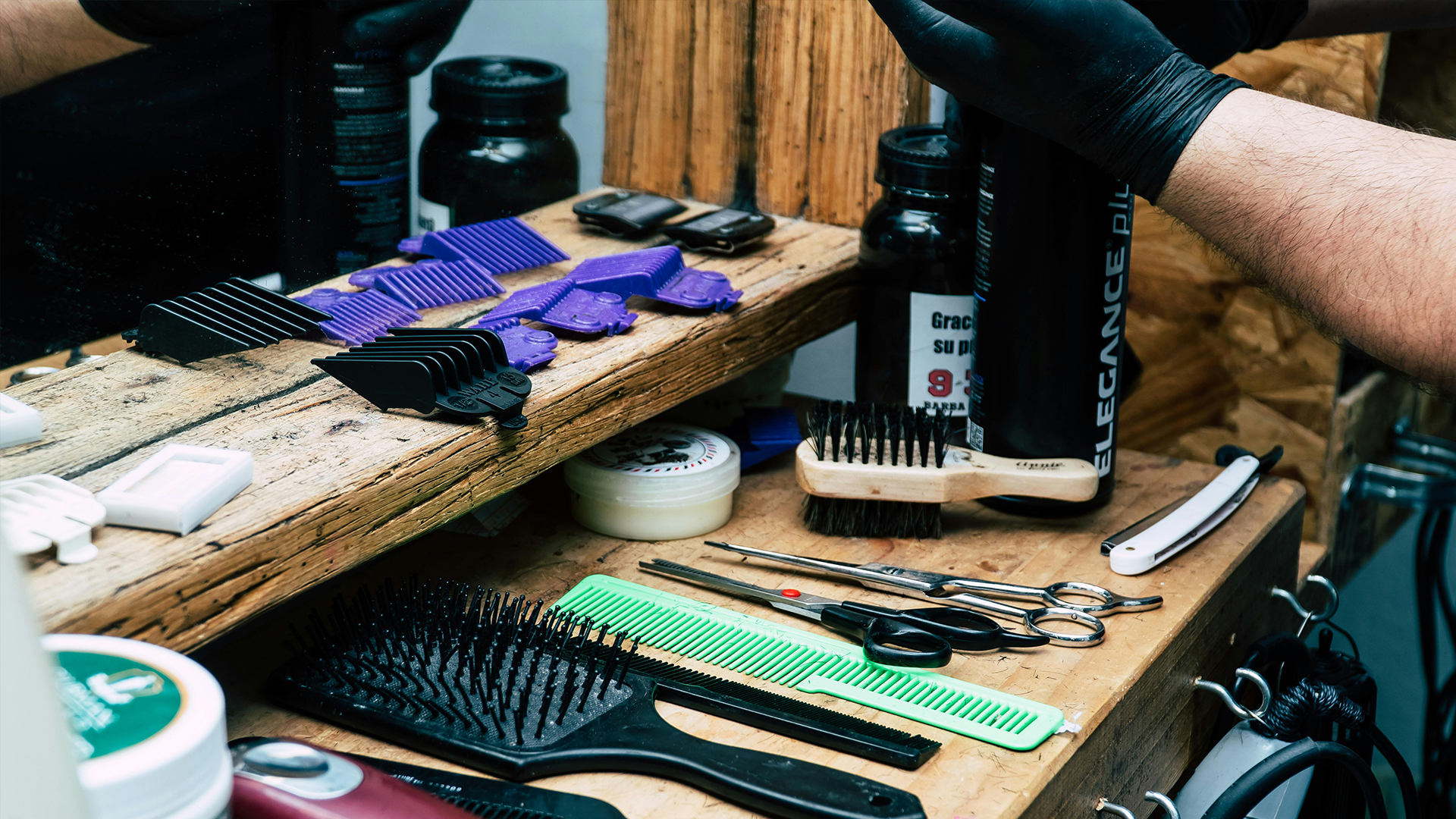 Barbering tools laid out across table.