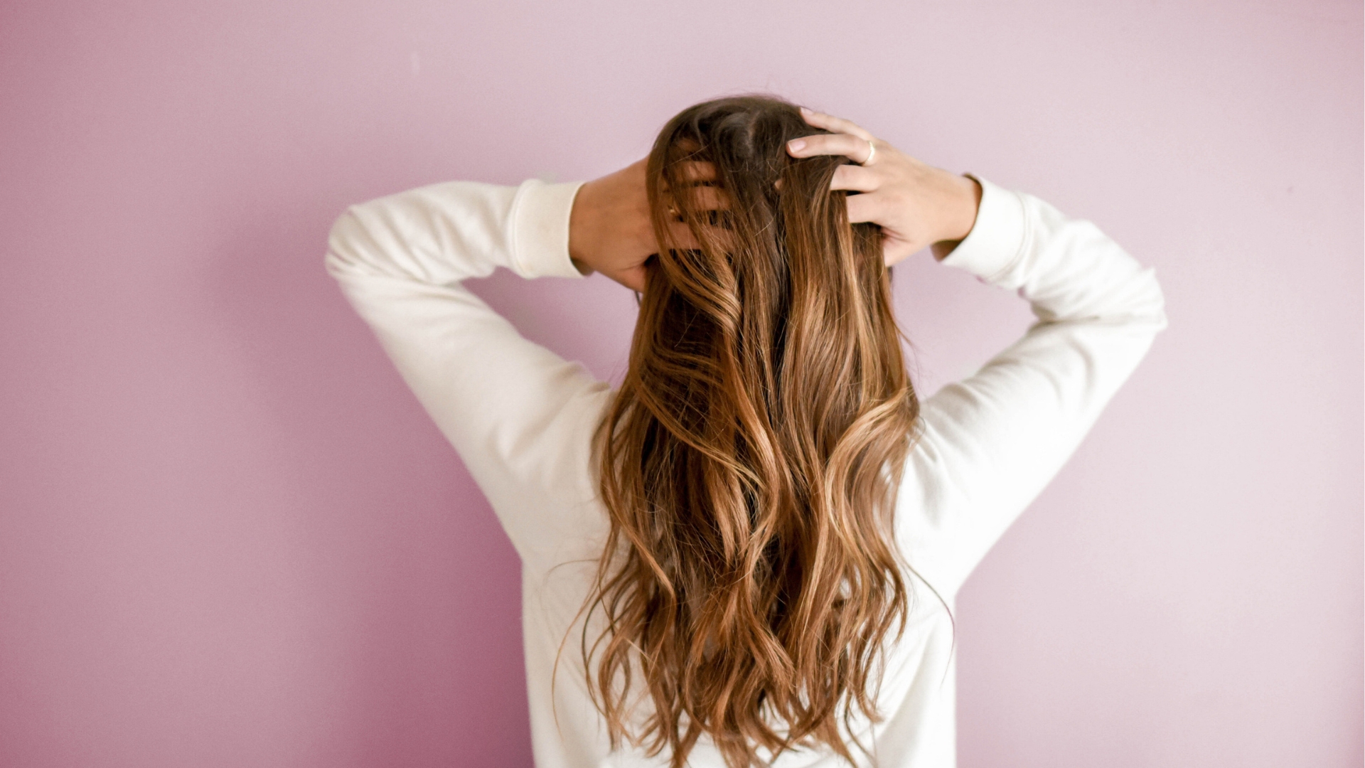 Girl flicking hair forward.