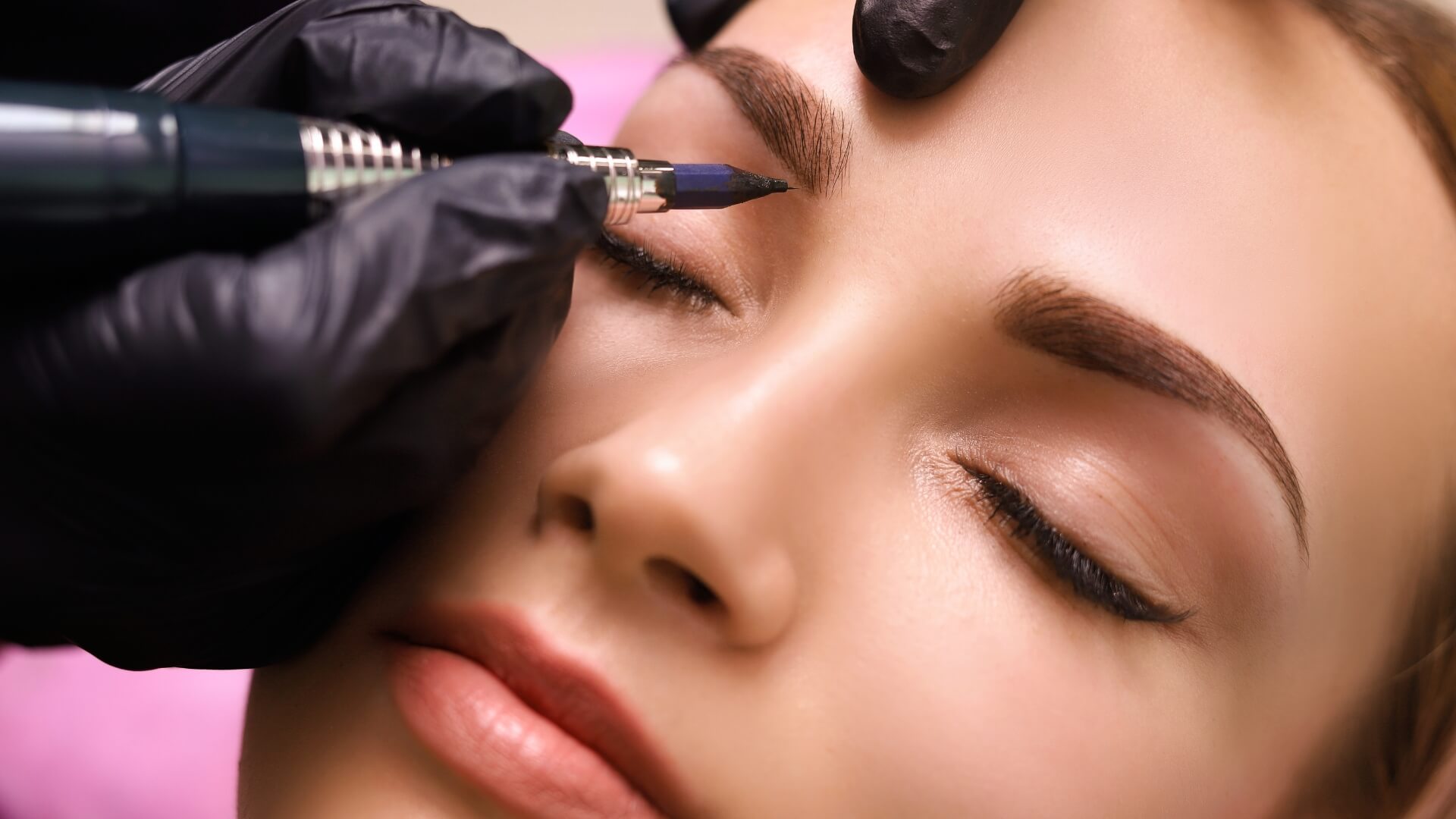 Person recieving brow treatment.