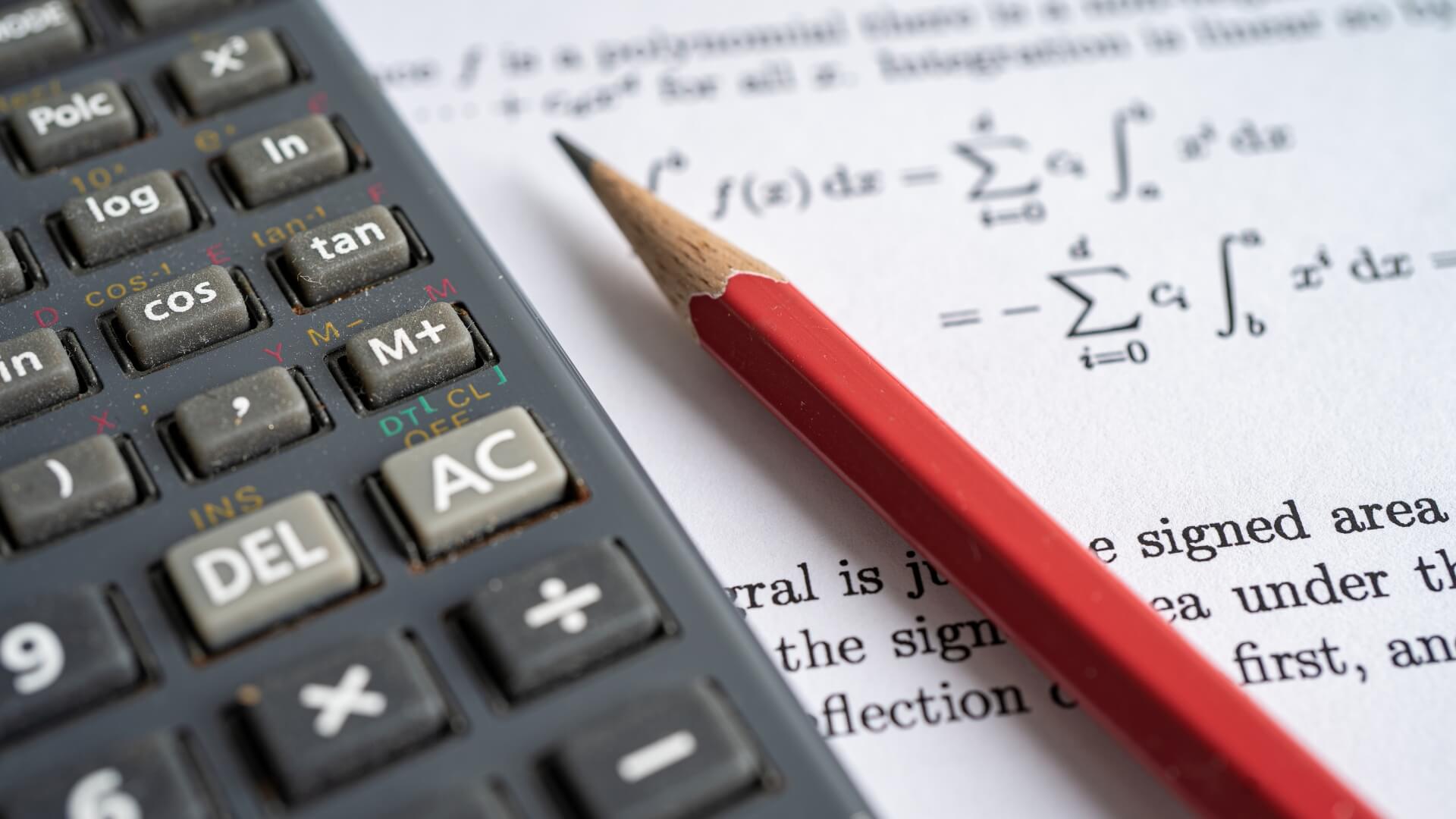 Mathes textbook open on a section about angles and calculator.