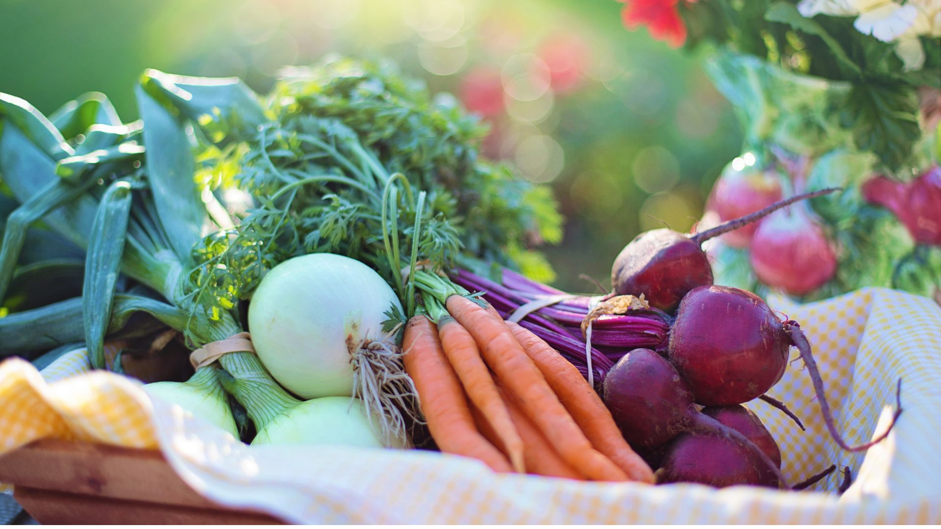 Heart-shaped bowl surrounded by fruit and vegetables