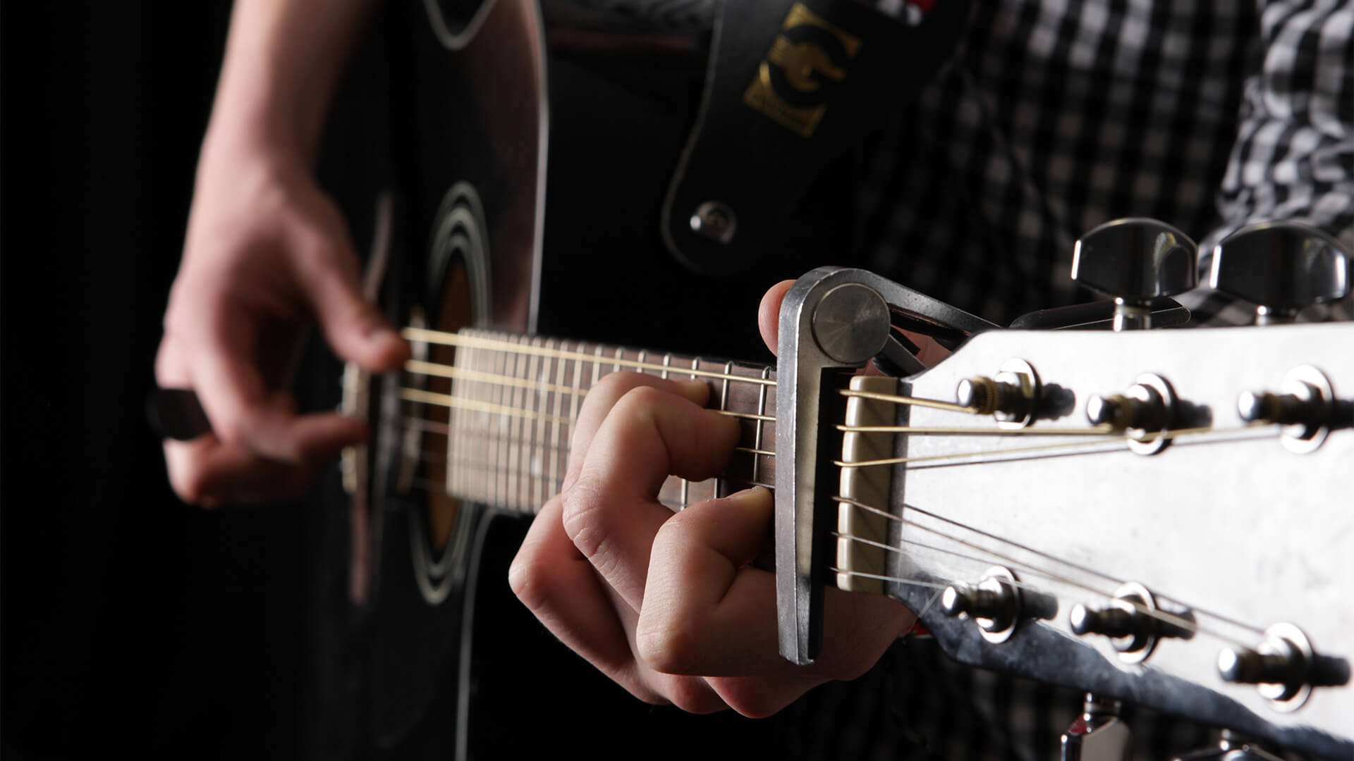 A person playing guitar.