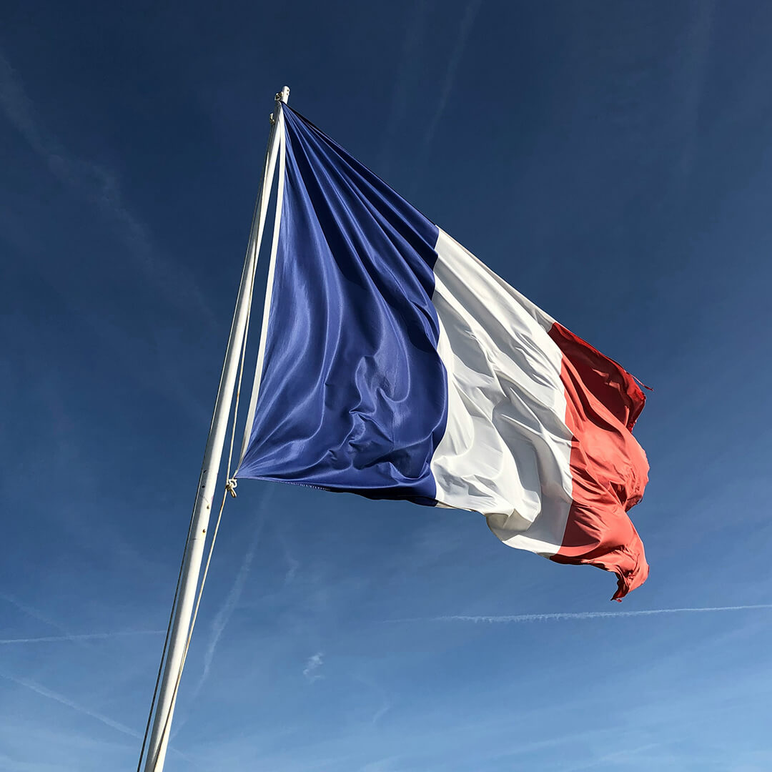 The French flag blowing in the wind.