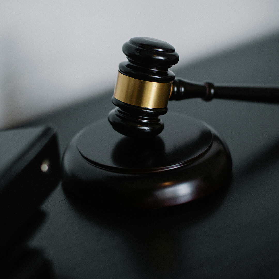 A Judges gavel on a desk.