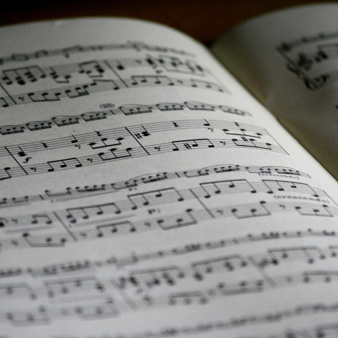 An open book of sheet music.