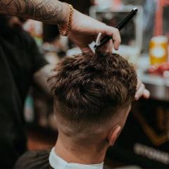 A barber cutting hair 