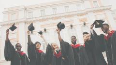 University Gradates Throwing Their Caps 