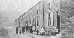 Black and white photo of Houghall Colliery Terrace Houses from 1800s with some residents on Cross Street