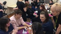 A group of students and staff doing beauty treatments at Learning for Life