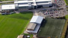 Aerial shot of East Durham College main campus building, football pitches including all-weather pitch