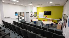 Childcare lecture theatre at EDC's Peterlee campus, shot shows raised seating looking down at a presentation area