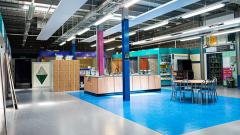 Wide shot of EDC's Painting and decorating workshop with bays and paint cans visible