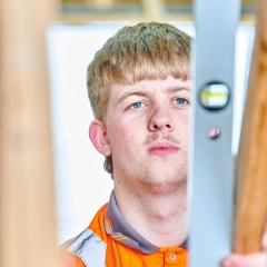 Carpentry &amp; Joinery student using spirit level